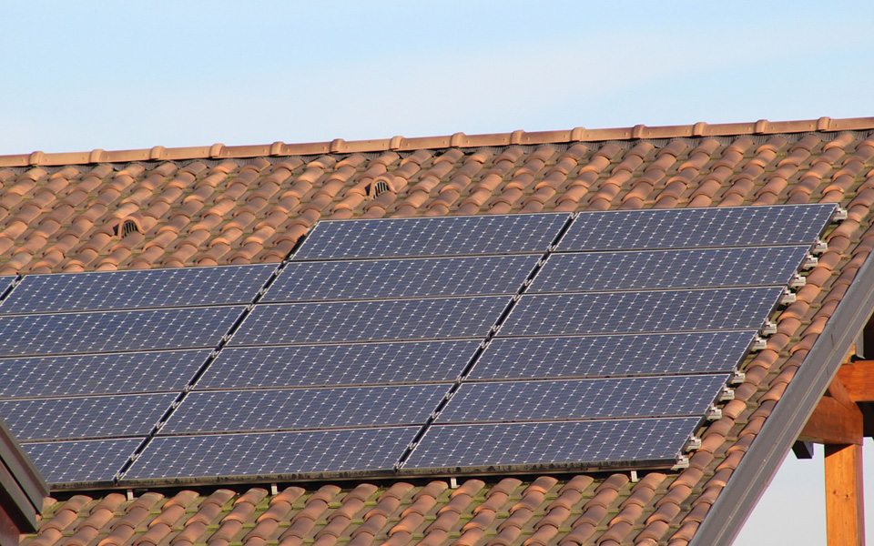 Photovoltaic solar panels on traditional wooden roof